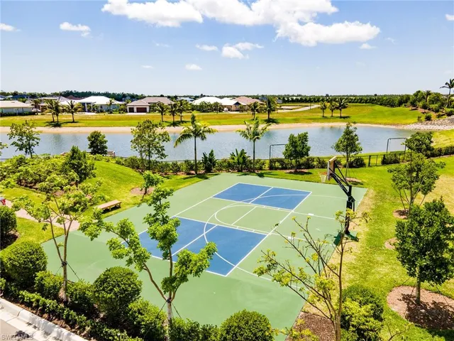 View of basketball court with a water view