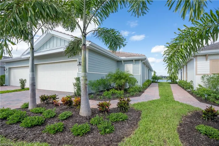 View of side of property featuring a garage