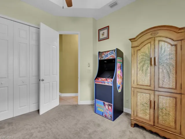 Rec room with carpet and ceiling fan