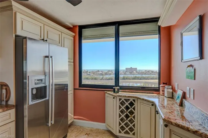 BUCCANEER LAGOON AND GULF OF MEXICO VIEWS!  CUSTOM CABINETRY WITH GRANITE COUNTERTOP AND BUILT-IN WINE RACK.  LIGHTED TRAY CEILING.  IMPACT RESISTANT WINDOWS WITH ELECTRIC SHUTTER.