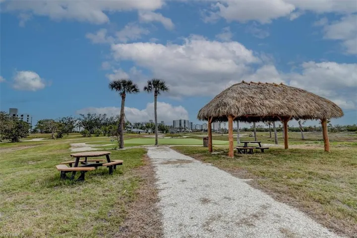 BAY BEACH COMMONS PUTTING GREEN.  TIKI HUT.  PICNIC TABLES.