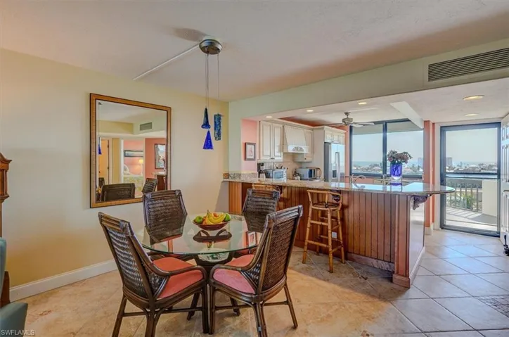 DINING / BREAKFAST BAR.  BREAKFAST BAR HAS BEAUTIFUL WOOD DETAILS.
