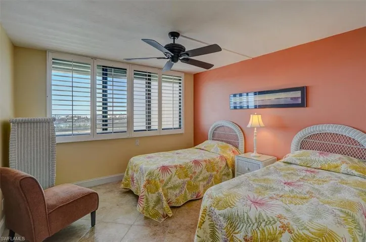 SOUTHERN EXPOSURE GUEST BEDROOM WITH BUCCANEER LAGOON AND GULF VIEWS.  IMPACT WINDOWS.  ELECTRIC STORM SHUTTERS.