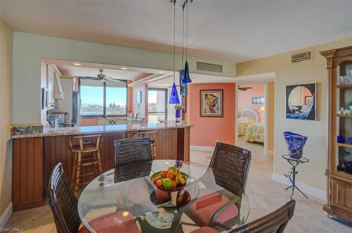 VIEW FROM DINING AREA TOWARDS KITCHEN AND GUEST BEDROOM