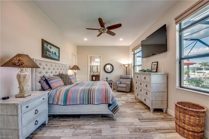Master Bedroom features new Porcelain Tile, Her Walk in Closet to the right of bed, and his Walk in closet to the left of bed, door leads to Master Bathroom