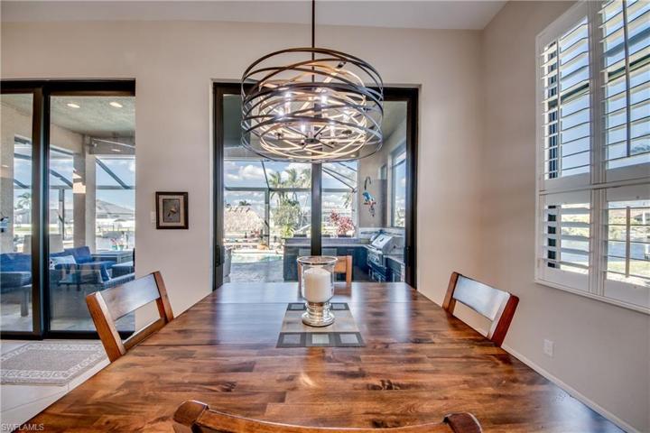 Dining area off kitchen overlooks paradise outside