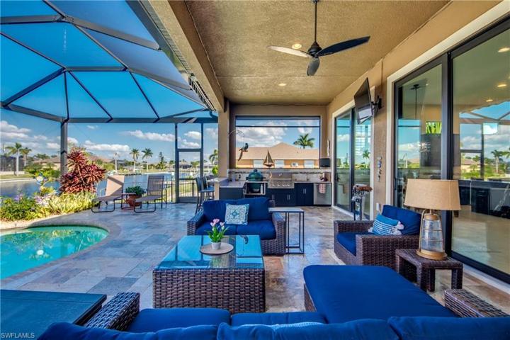 All Lanai Furniture Stays with home !!!!!!!!!!!!!!!!!!!!!  This desired Northern exposure home is built with the outdoor enthusiast in mind.  The pool is built out a distance from the house with an expansive deck that allows sun on the pool all day and shade on the under truss porch all day !!