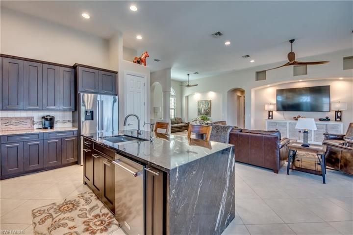 kitchen features pull out drawers in Pantry, High End Granite on Island, Tile is on diagonal