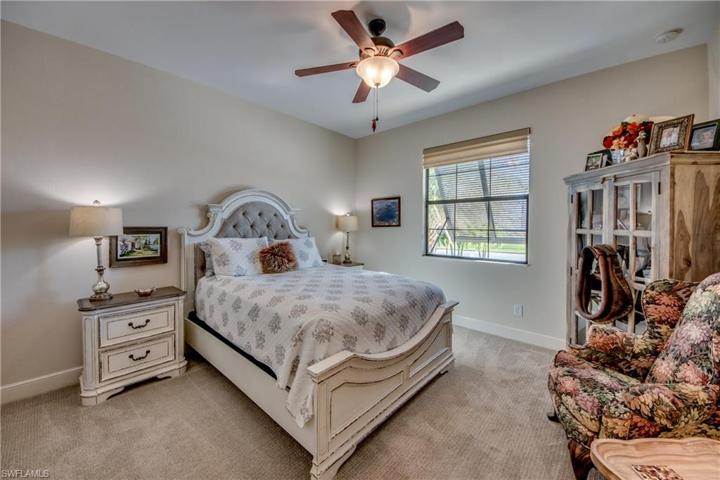 Guest Bedroom #2 in front of home with new Bahama Shutter outside window