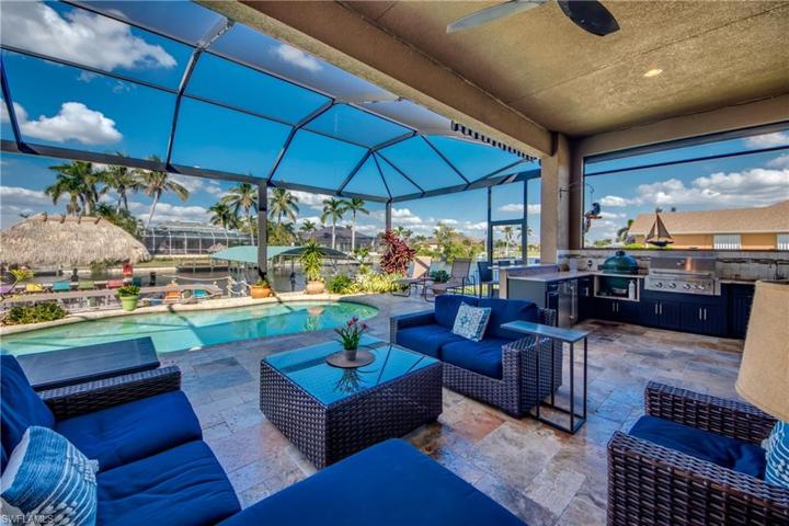 This NEW oversized Lanai is screened in with NO-SEE-UM screen, Panorama Window Screens, and Reinforced 4X8 Beams .  Over the Bar to the right is a Remote Control Sunsetter Shade.  Desired Northern exposure with shade on the patio and sun on the pool.  The extended deck around the pool brings the sunshine in!!!!
