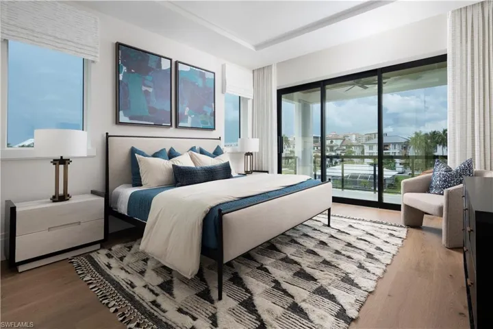 Bedroom featuring access to outside and wood finished floors