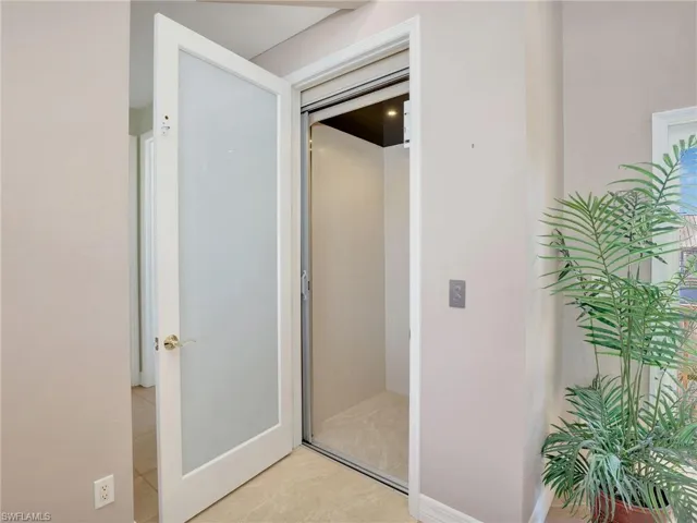 WHISPER SOFT ELEVATOR TAKES YOU UPSTAIRS FROM THE GARAGE AREA