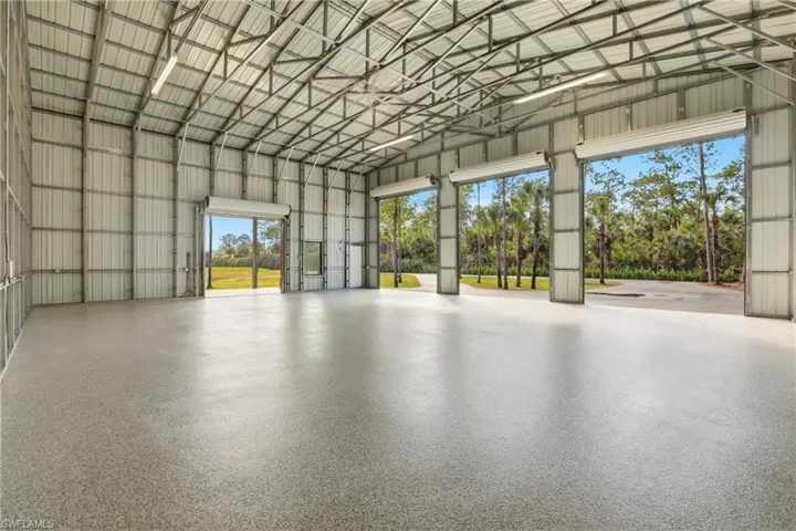 Garage featuring metal wall