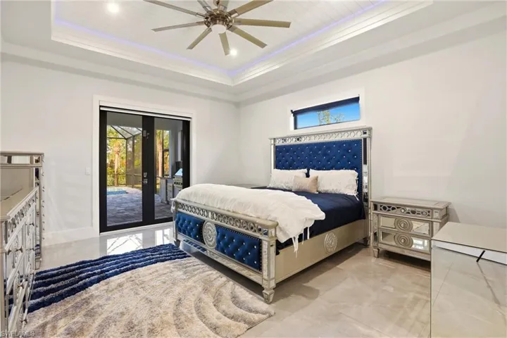 Bedroom with french doors, access to outside, crown molding, ceiling fan, and recessed lighting