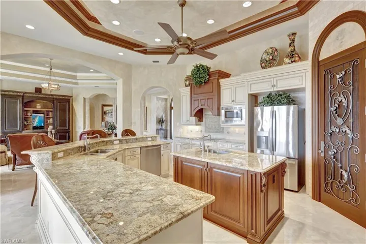 The luxurious kitchen offers lots of storage space, including a walk-in pantry.