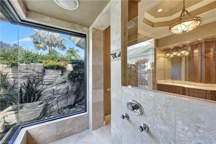 Enjoy the peaceful view while taking a morning shower.