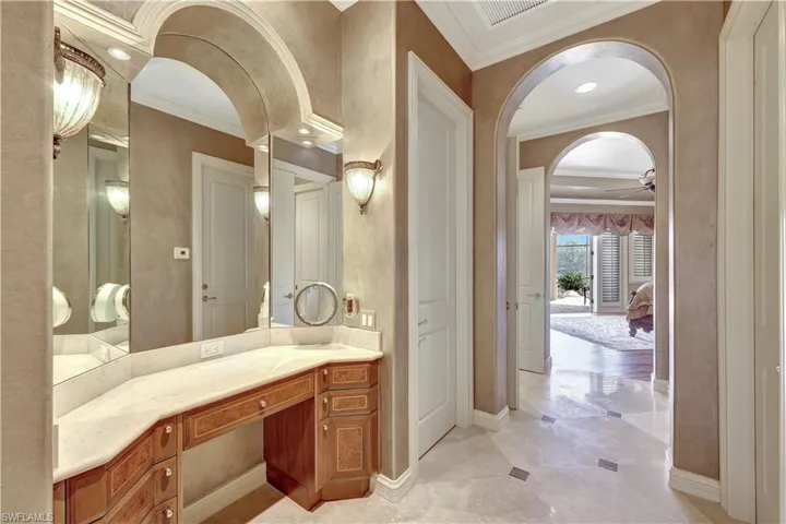 Prepare for  your day in this vanity area, which features separate sinks and plenty of storage space.