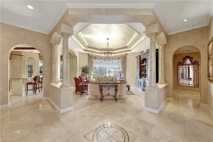 The great room opens to the kitchen, dining room and outdoor area. each with its own breathtaking view.