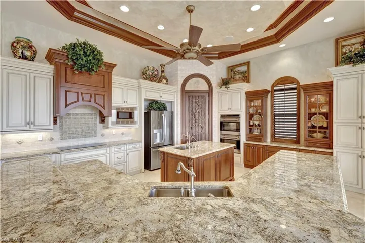 There's an additional sink in the center island, a practical space for washing fruits and vegetables.