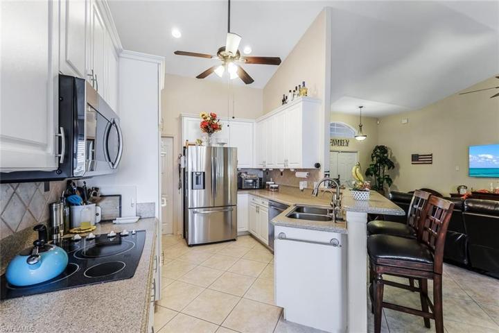 With Corian Countertops and Breakfast Bar