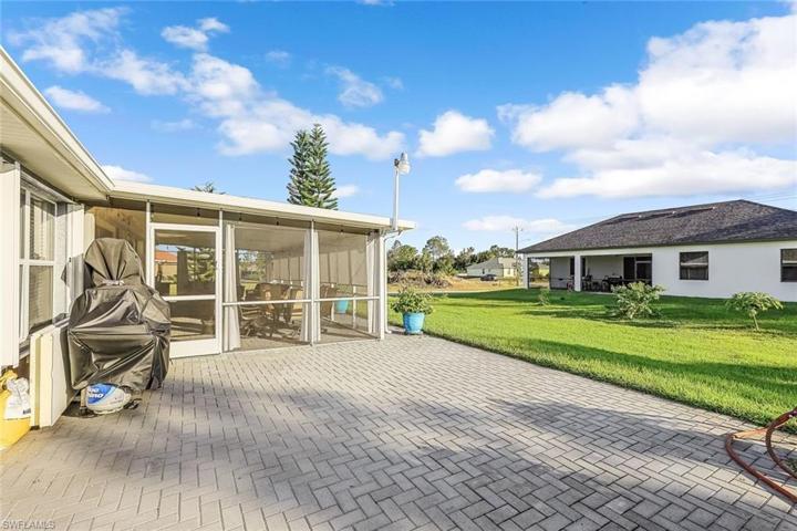 Large paver uncovered lanai, perfect for cooking out and entertaining.