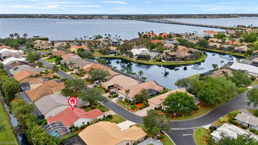 Birds eye view of property with a water view