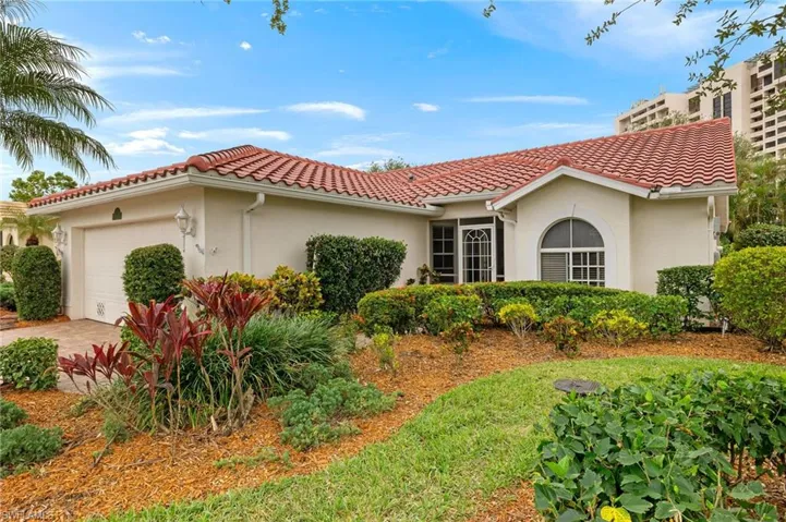 Mediterranean / spanish-style house with a garage