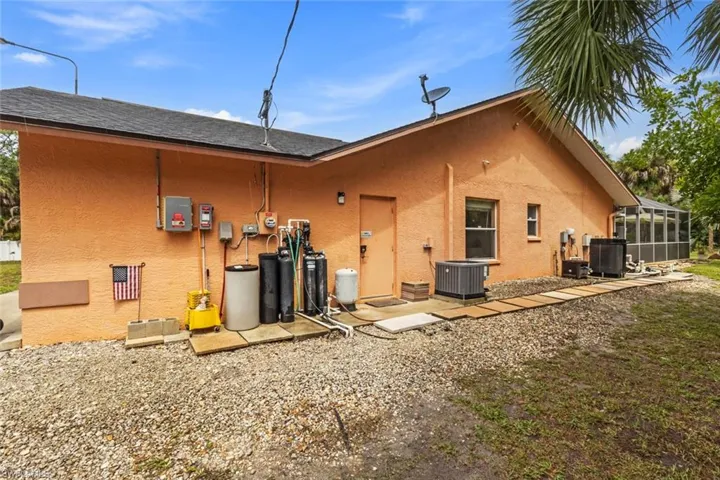 Exterior on right side of home with pool new pool heater (2025).