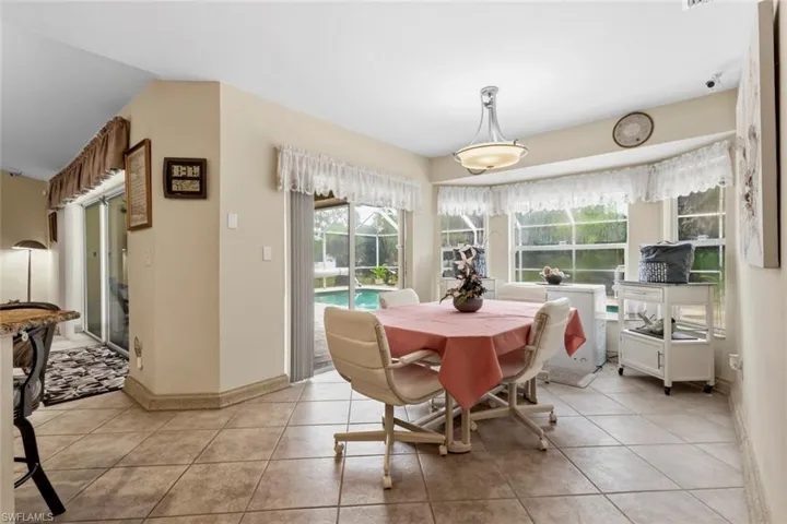 Tiled flooring throughout with a semi-flush mount ceiling light fixture