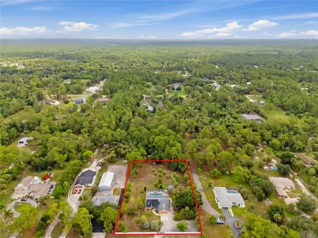 Aerial showing approximate area that is flood zone X.  Showcasing the home a private swimming pool and extensive landscaping.