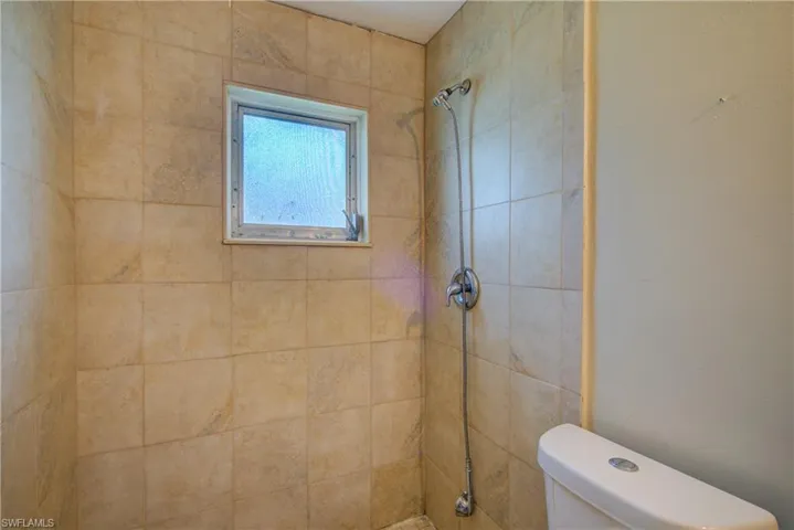 Full bath with a tile shower