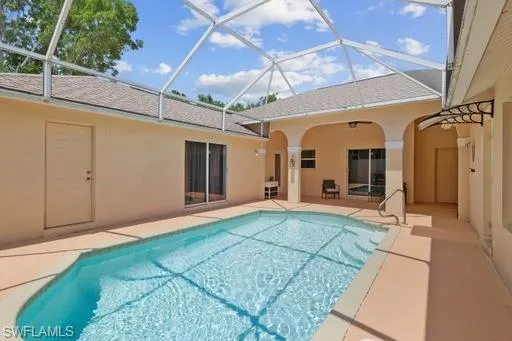 View of pool featuring a lanai and a patio