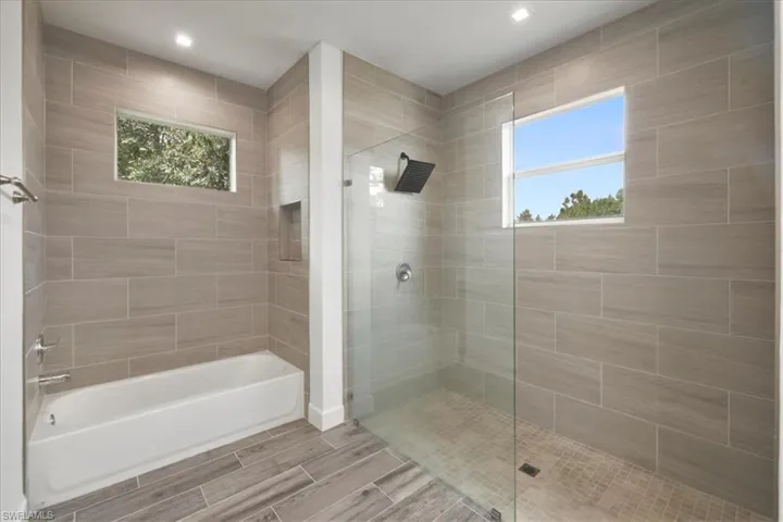 Bathroom featuring wood finish floors and recessed lighting