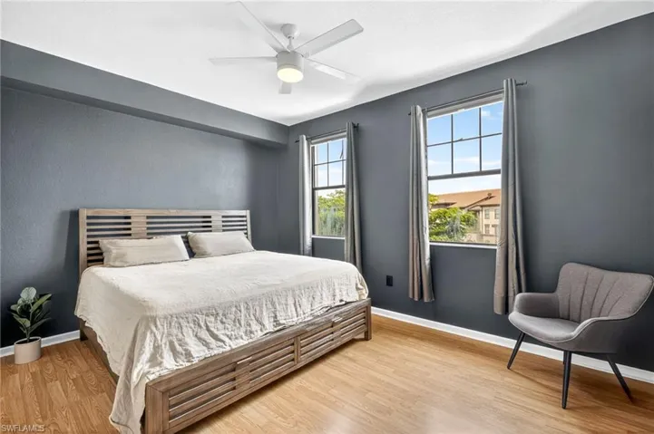 Bedroom with light wood finished floors and ceiling fan