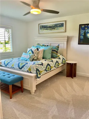 Bedroom featuring carpet floors and ceiling fan