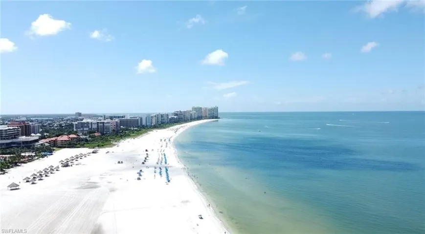 Water view with local beach and nearby urban area