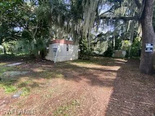 View of yard featuring a shed