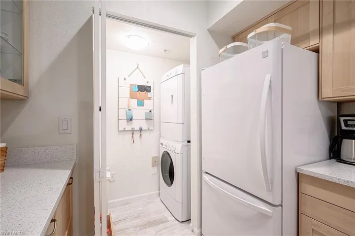 stackable washer dryer off kitchen area