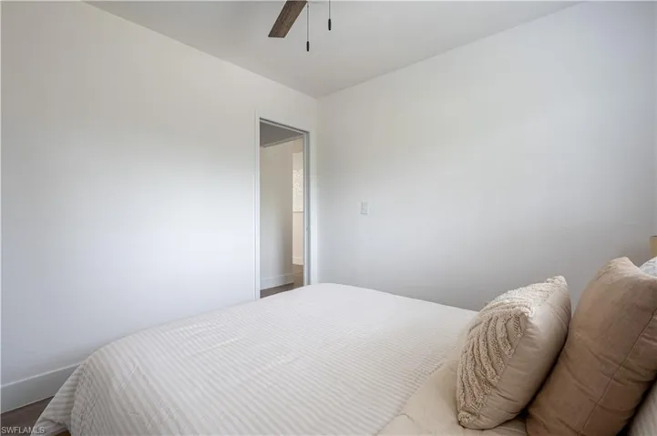Bedroom with wood-type flooring and ceiling fan