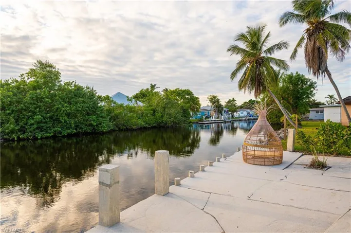 Property view of water with a boat dock