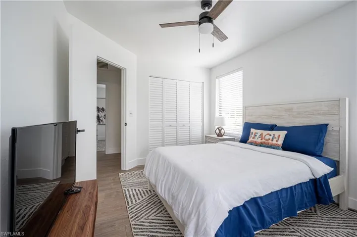 Bedroom featuring a closet, ceiling fan, and hardwood / wood-style floors
