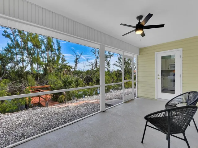 Sunroom / solarium featuring ceiling fan