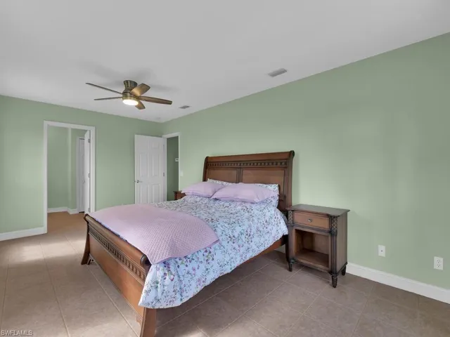 Tiled bedroom with ceiling fan