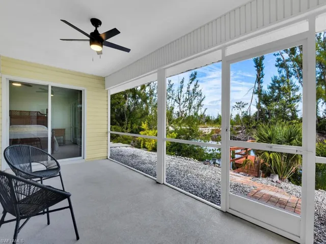 Sunroom / solarium featuring ceiling fan and a healthy amount of sunlight