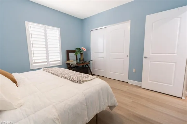 Bedroom with a closet and light wood-type flooring