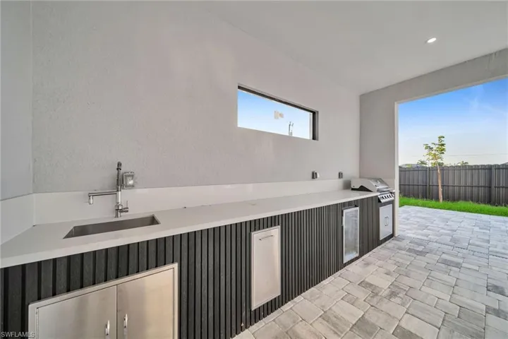View of patio / terrace with a grill and sink