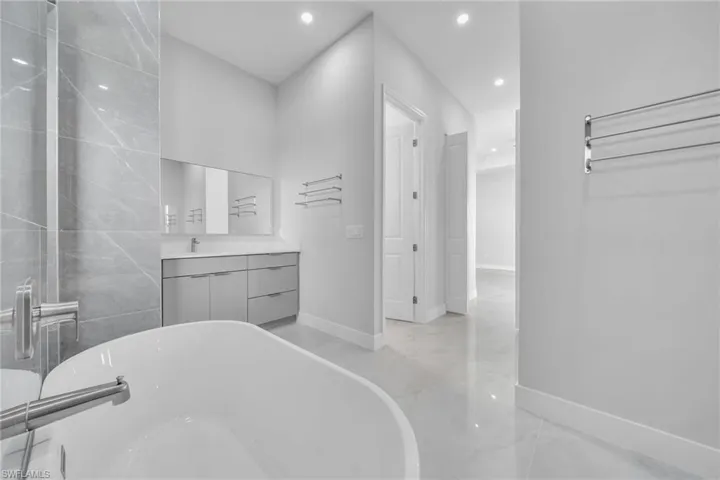 Bathroom with vanity and a bathtub