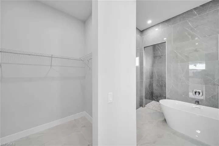 Bathroom featuring plus walk in shower