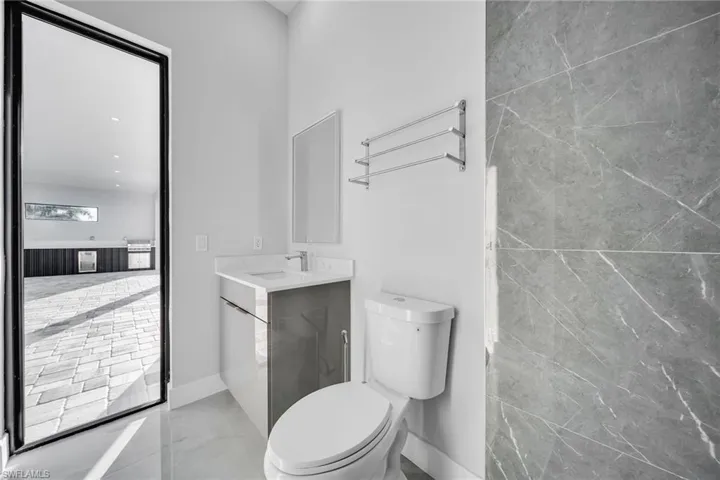 Bathroom with vanity and toilet
