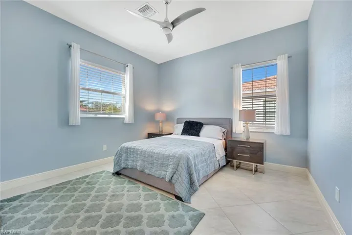 This oversized guest bedroom also features a huge walk-in closet with wood built-ins!
